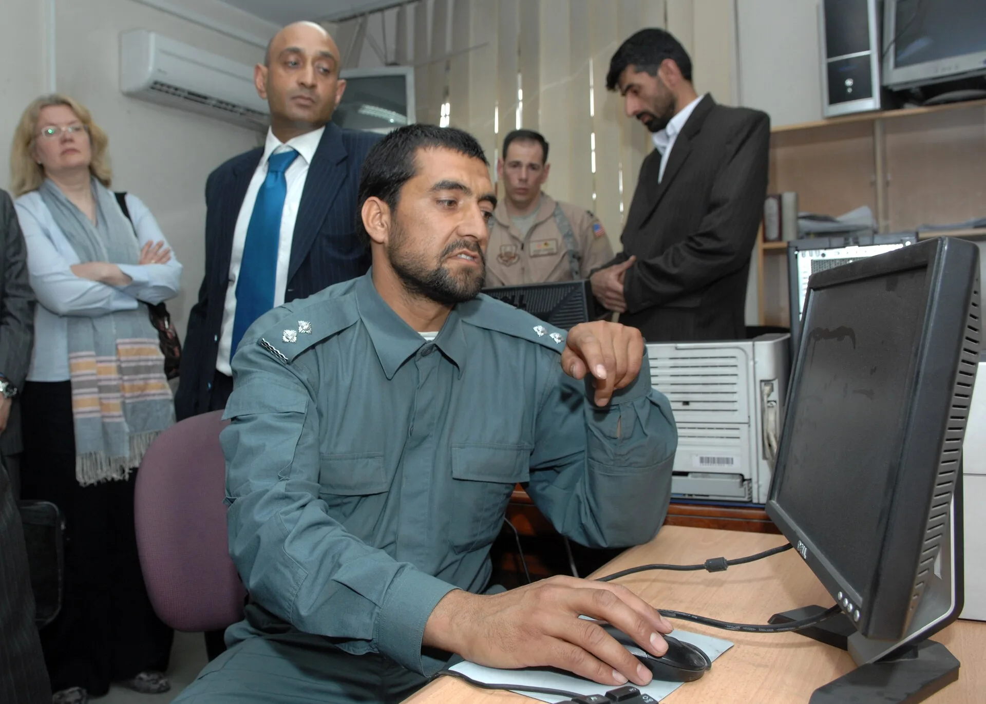 Ministry of Interior (May 3, 2010)-- An Afghan National Police officer demonstrates the proper procedure for sending messages via cell phone text messaging to inform an Afghan Policeman that his monthly salary is ready. The pay-by-phone program that was recently activated at the MoI for the Afghan N. Informational influence mistakes seen from the repair side