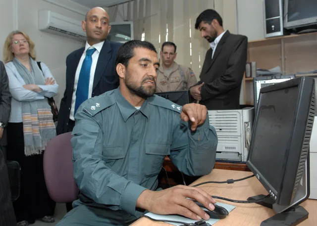 Ministry of Interior (May 3, 2010)-- An Afghan National Police officer demonstrates the proper procedure for sending messages via cell phone text messaging to inform an Afghan Policeman that his monthly salary is ready. The pay-by-phone program that was recently activated at the MoI for the Afghan N. Informational influence mistakes seen from the repair side