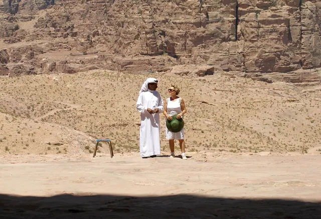People in conversation. Petra, Raqmu, Jordan. Normative influence exercises explained with examples