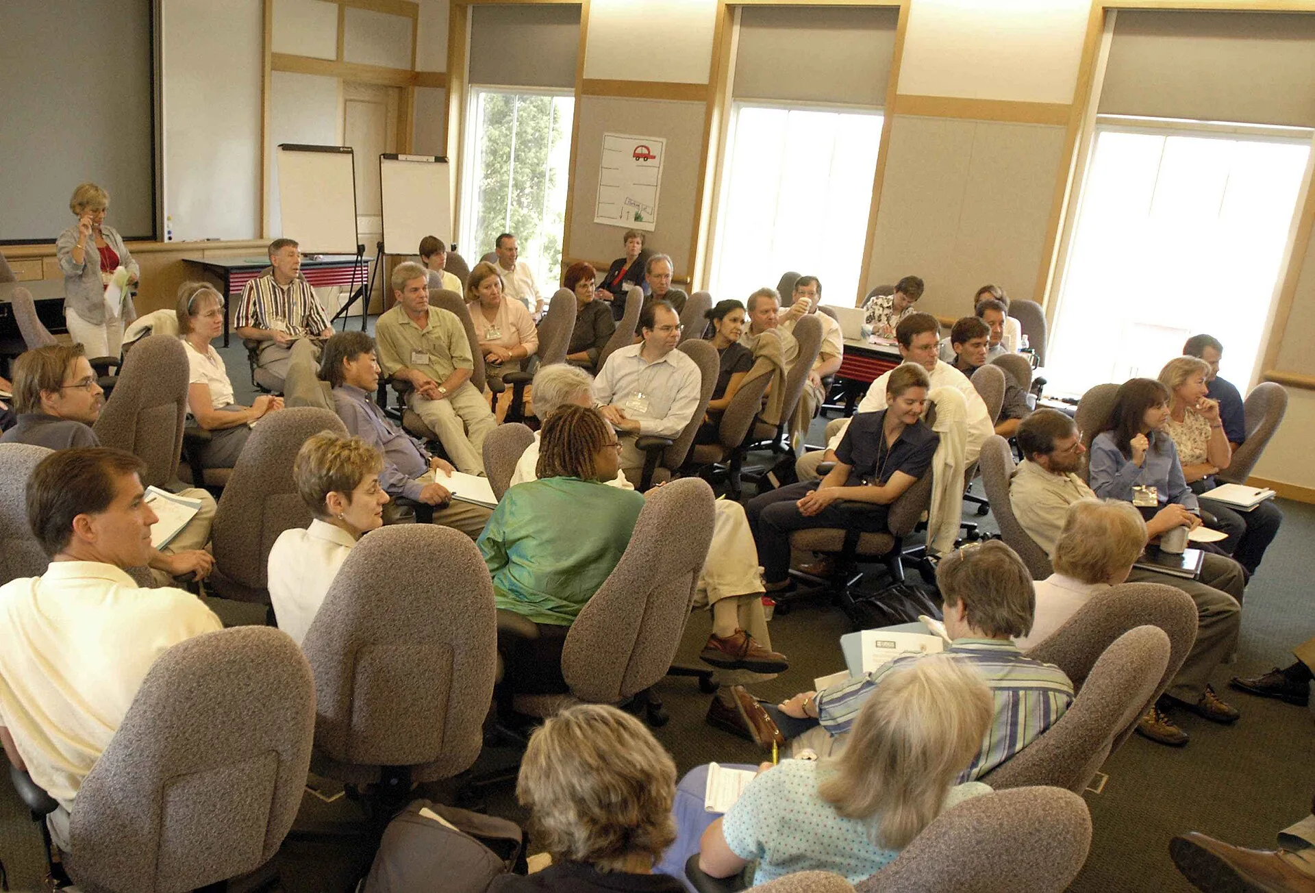 Image title: Audience in classroom listening intently to speaker during meeting Image from Public domain images website, http://www.public-domain-image.com/full-image/people-public-domain-images-pictures/crowd-public-domain-images-pictures/audience-in-classroom-listening-intently-to-speaker-during-m. Normative influence techniques for leading a meeting